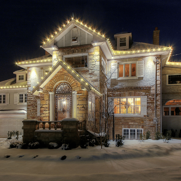 Close-up view of roofline Christmas lighting installation